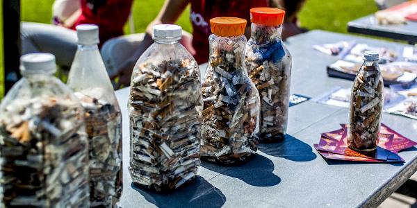 Student volunteers clean up cigarettes around campus