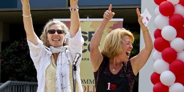 Superintendent-President Dr. Lori Gaskin (right) and Dean Dr. Alice Scharper sing in 2013. Gaskin will be retiring at the end of the school year.