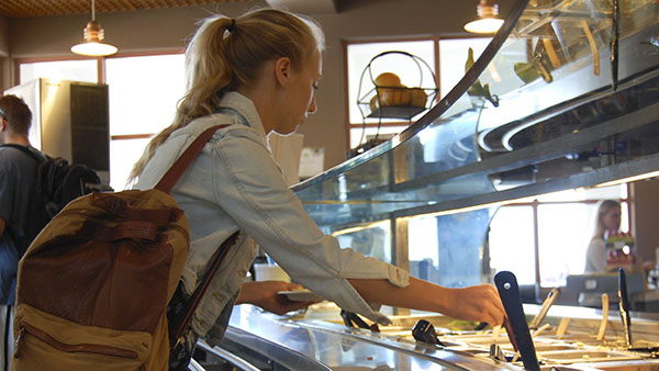 Jennifer Bowman, 20, communications student, browses through her options at the new salad bar in the Snack Bar cafeteria at City College on Wednesday, Sept. 11, 2013 in Santa Barbara, Calif.