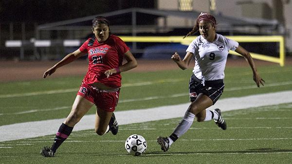 Briana Lopez (No.21) for Santa Barbara City College fights for the ball against Jessica Castillejo (No.9) LA Pierce College. On Oct, 4, 2013 at La Playa Stadium.