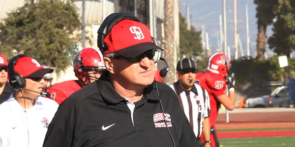 Vaqueros football head coach Craig Moropoulos heads back to the locker room after their 17-38 loss at La Playa Stadium on Saturday, Nov. 2, 2013 in Santa Barbara, Calif.