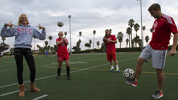 At La Playa Stadium, international students from left Fanny Johannson, Emilie Nettyberg, Mike Peterson, and Adam Colton come together to represent a variety of sports of football, soccer, and Golf on Nov. 21.