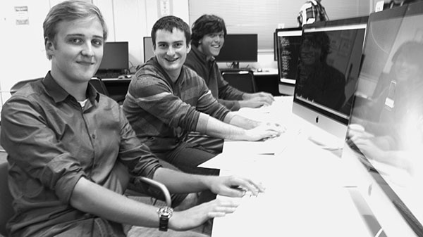 On city college campus, students from the ICPC challenges panning from front to back, Erwan Lent, Joel Green, and Ben Rhoda look tab the screen in amazement in the ECC lab on Nob. 21, 2013.