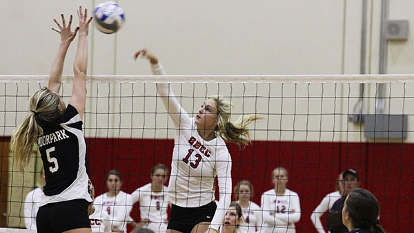 Vaqueros middle blocker Kristy Kearney (No.13) spikes the ball through Moorpark Colleges middle blocker Heather Handberg (No. 5) during the volleyball match at the City College Sports Pavilion in Santa Barbara, Calif. on Friday, Nov. 8, 2013.