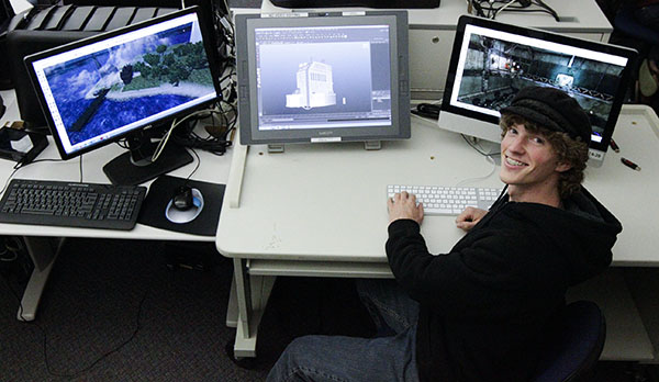 Andrew Price, 19, video game and animations major, designs in the Digital Arts Lab at City College on Thursday, Oct. 31, 2013, in Santa Barbara, (Calif.) He is working on an environmental buildings project in the program Maya. 