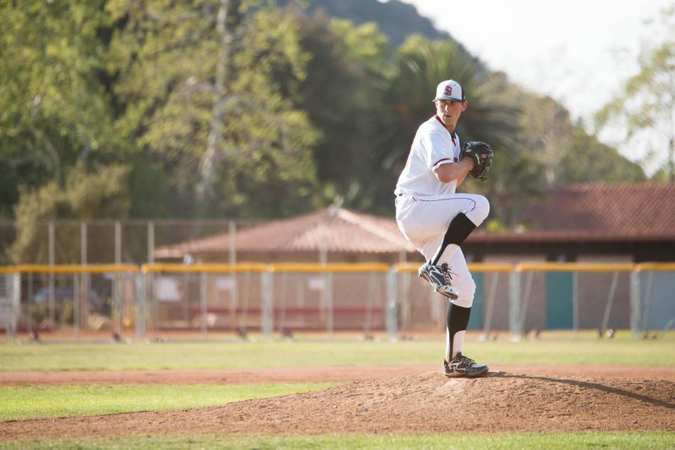 Tyler Gilbert (No.12) goes into his windup at the Vaqueros’ home game against East Los Angeles College on Thursday, Feb. 20, at Pershing Park in Santa Barbara, Calif.  City College went on to win the game 11-6. 