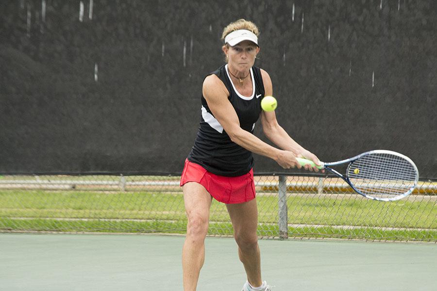 City College freshman Monica Kunz returns a serve during a match against College of the Sequoias Saturday, Feb. 8, 2014, at Pershing Park in Santa Barbara, Calif. 