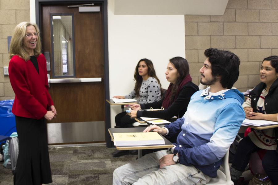 English Professor Jody Millward laughs with her students before class in her classroom at the Interdisciplinary Center at Santa Barbara (Calif.) City College on Feb. 28, 2014. Millward is one of four two-year-college professors who won the prestigious Hayward Award.