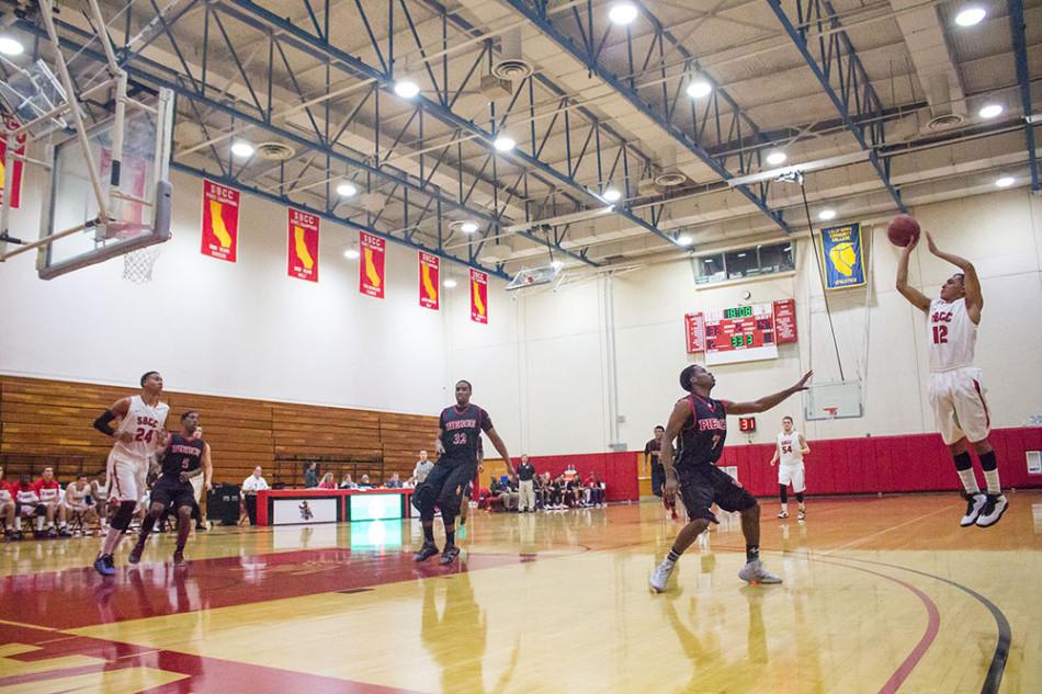 City College's sophomore guard, Pablo Miranda (No. 12), attempts a three-point shot against Los Angeles Pierce College on Saturday, Feb. 22, in Santa Barbara. Miranda finished the game with 10 points as the Vaqueros lost to the Brahmas 96-87.