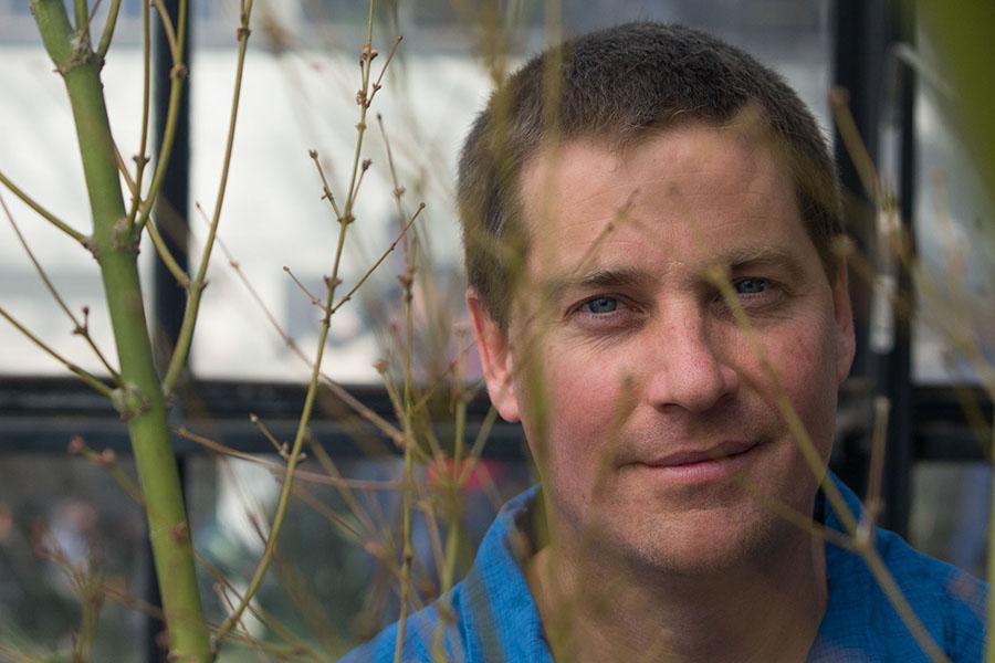 Matthew Kay, the newly hired Botany Professor, spends time in the greenhouse on East Campus of City College in Santa Barbara Calif. Wednesday Feb. 12.