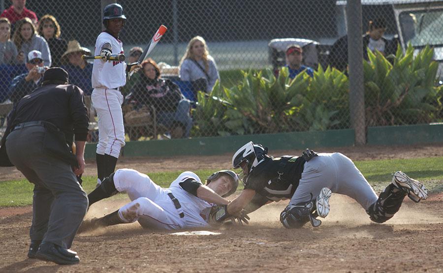 Trey Barrett (No.44) slides in safely at home plate during City College Vaqueros baseball home opener against Napa Valley College on Friday, Jan. 31, at Pershing Park in Santa Barbara. The Vaqueros won the first game of the three-game opening series 9-3.