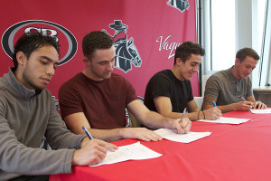 Men’s soccer players Juan Diaz Casallas (left), George Wakefield, Jamie Sporcic and Adam Colton commit to play at the University of Hawaii at Hilo on Thursday, Feb. 6, in Santa Barbara.