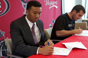 Tavonte Jackson (left) signs his letter of intent to Idaho State University and Jackson Weed signs with Glenville State College at a press conference on Thursday, Feb. 6, in Santa Barbara.