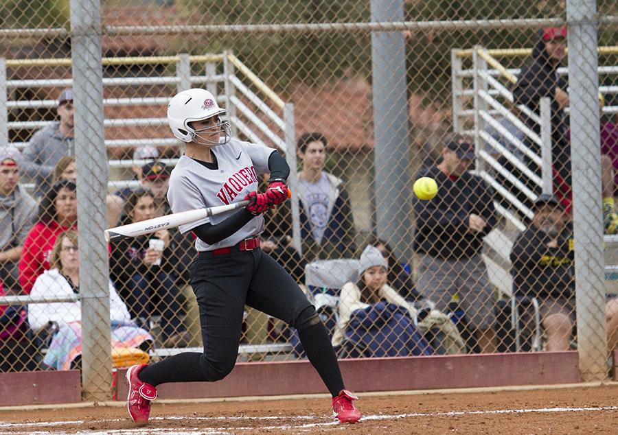 Brianna Portese (No. 7) knocks a base hit to left field during the second game of the Vaqueros softball home opener against Pasadena City College on Saturday, Feb. 8, at Pershing Park in Santa Barbara.