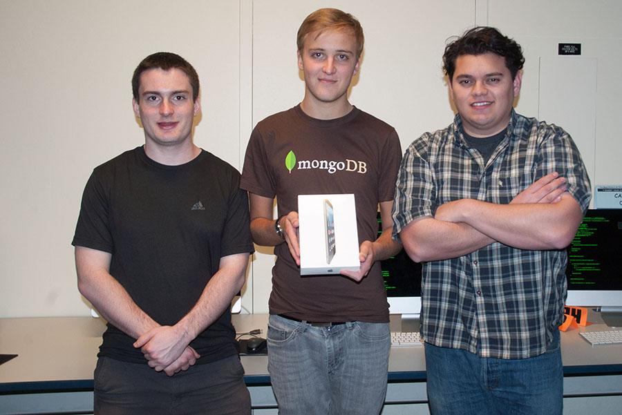 Three City College students,  (from left) Joel Green, Erwan Lent and Alberto Villalobos,  display their prize, an iPad mini, after winning the Hacktech hackathon.