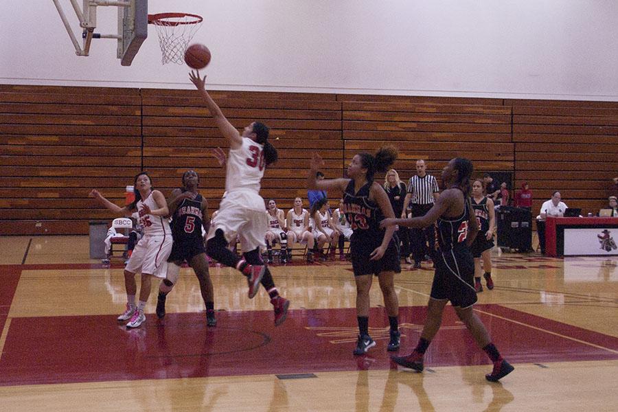 Elia Salazar (No. 30) makes a layup shot in City Colleges win, 73-68, over LA Pierce College on Saturday, Feb. 22.