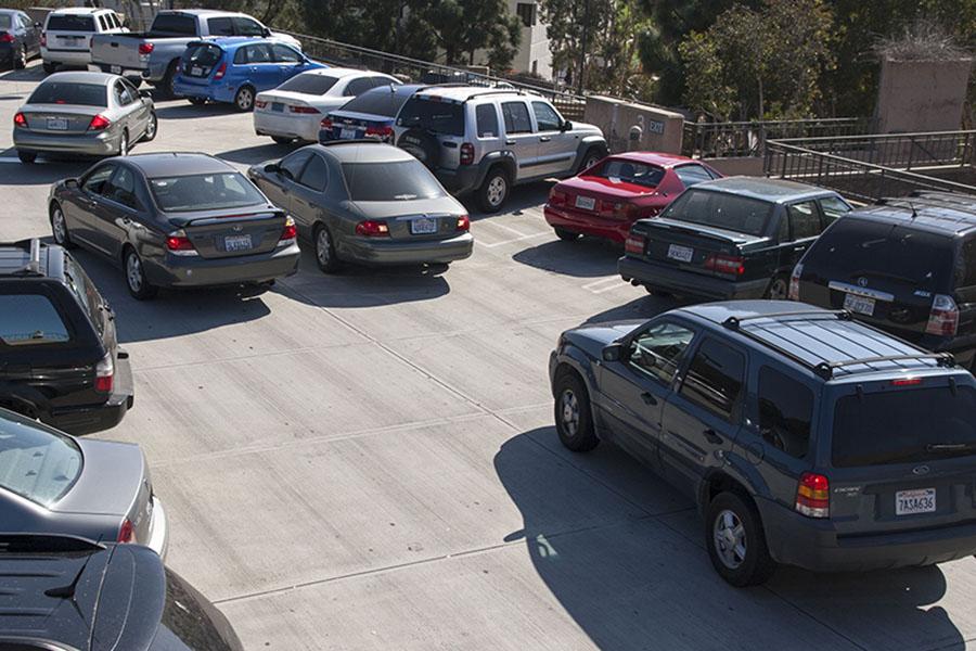 A traffic block is formed by cars waiting for open parking spots on Tuesday, Feb. 25, at parking lot 5-3 on West Campus, in Santa Barbara. Drivers have to wait several minutes for spots to open up because of the lack of parking at City College Campus.