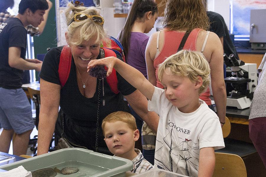 Gus Larson holds up a sea urchin to show it to his mother, Kristen Larson, and Liam Killen, at the first annual Science Discovery Day, Saturday, March 15, in the Earth and Biological Sciences Building on City College’s East Campus. The event was organized by the Science, Technology, Engineering and Mathematics Transfer program to gain interest in science throughout the community.