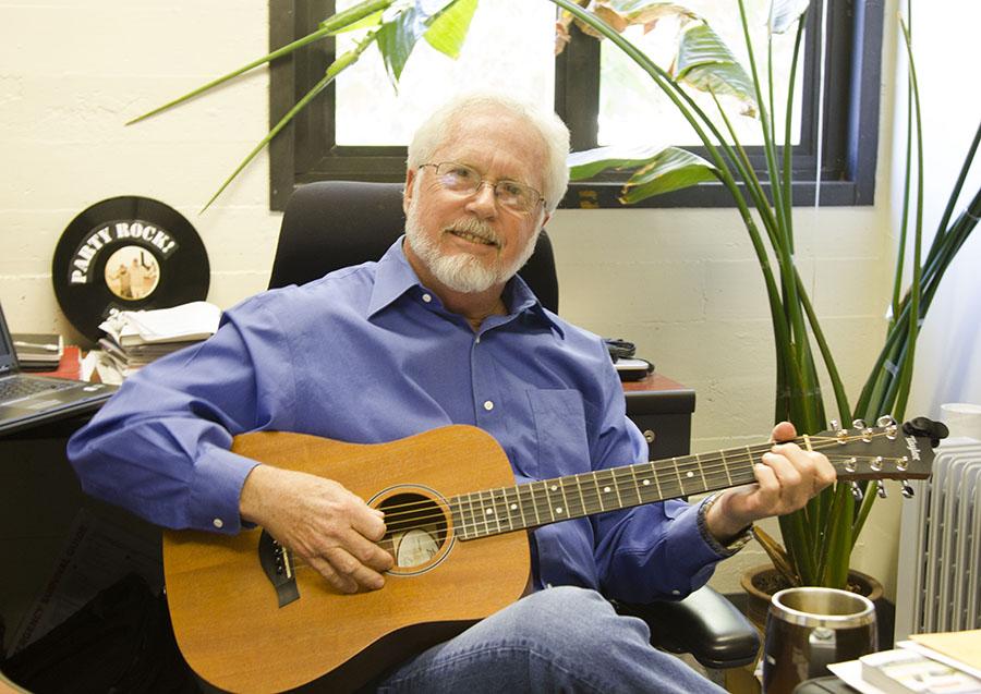Paul Bishop, vice president of Information Technology at City College plays Friday Blues in his office on Feb. 21. Bishop won the 2013 Technology Leadership Award.