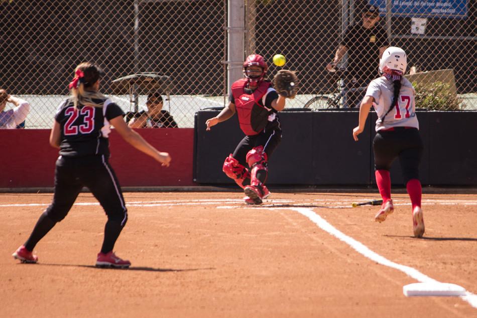 City College freshman infielder, Christal Vierra (No. 17), heads home after Brianna Porteses base hit as Vikings catcher Jenny Santiago prepares for the throw from Melyssa Rivas (No. 23). Vierra scored but it wasn’t enough as the Vaqueros lost, 17-6.