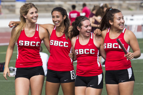 City College's women's 4x200-meter relay team members Alyssa Garrett (from left), Marla Bonser, Christina Khalil and Courtney Linhares glance over at coach Scott Fickerson before their event. The relay event took place at La Playa Stadium on Friday, March 21, in Santa Barbara.