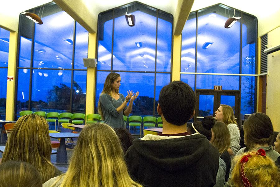 City College students attend an American Sign Language Club meeting, where President Jessica Clark, 20, explains the rules for a game in vocal silence, on Wednesday, March 5, in the Main Cafeteria at City College. Signing is a visual language in which the brain processes linguistic information through the eyes.