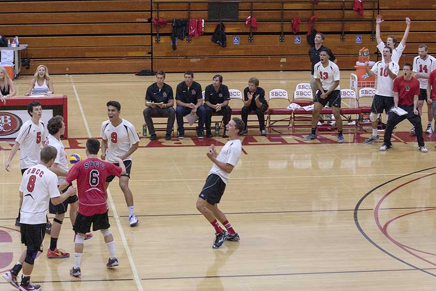 The Vaqueros celebrate as they tie the score, 14-14, in the fifth and final set against Long Beach City College Friday, April 11, at the Sports Pavilion in Santa Barbara. The Vaqueros went on to win the deciding set, 20-18, and won the match, 3-2.