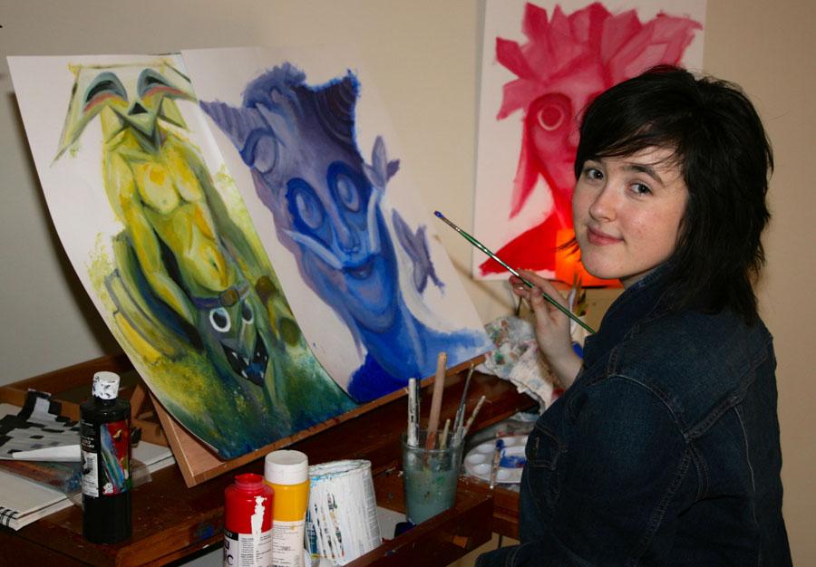 City College Student, Natalie Millan, 21, shows her art on Tuesday, April 15, 2014, at her home in Carpinteria, Calif. The artist attributes her art inspiration and passion for colorful creatures from her quiet times spent in the woods of Virginia.