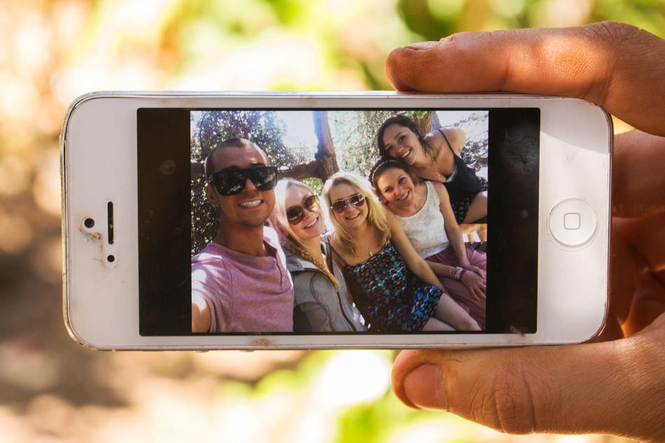 Members of City Colleges Beyond Selfies club, Marcus Tomlinson, (from left) Jocelyn Stradiotto, Devin Mayhew, Christine Bagwell and Sydney Campbell take a photo of themselves on Monday, April 7, in the Lifescape Garden on East Campus of City College in Santa Barbara. The club was formed in February 2014 and organizes fundraising methods for ambitious students.