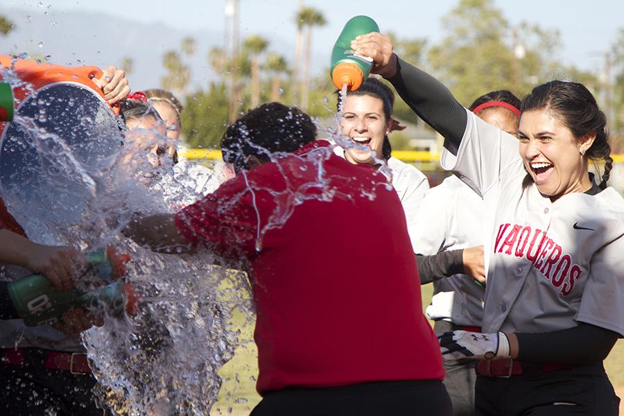 The team celebrates the victory by showering head coach Paula Congleton with water after winning both games against Moorpark College on Tuesday, April 22, at Pershing Park. The Vaqueros won, 6-2 and 7-0, and finished the regular season with an overall record of 22-14.