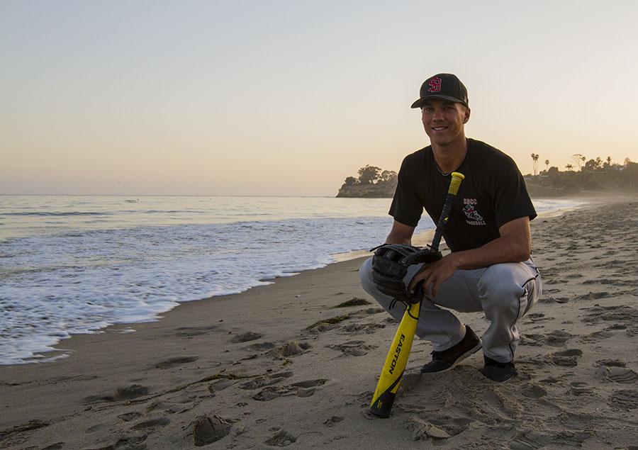 City College outfielder Connor McManigal, 19, takes a look at the surf after baseball practice on Tuesday, April 15, at Leadbetter Beach in Santa Barbara. McManigal has served as a Santa Barbara lifeguard in the past summers and leads the Vaqueros with a .326 batting average this season.