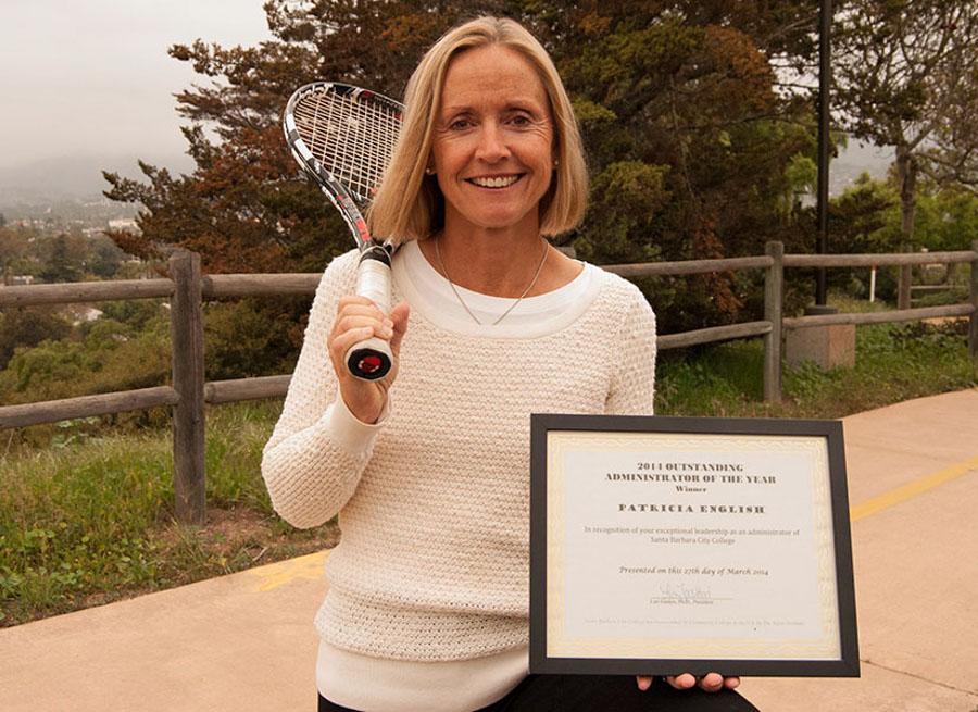 Patricia English, vice president of human resources, holds her Outstanding Administrator of the Year award for 2014 on East Campus, Friday April 18 in Santa Barbara, Calif. In her free time, she enjoys hiking, playing tennis and being a mother to four boys.