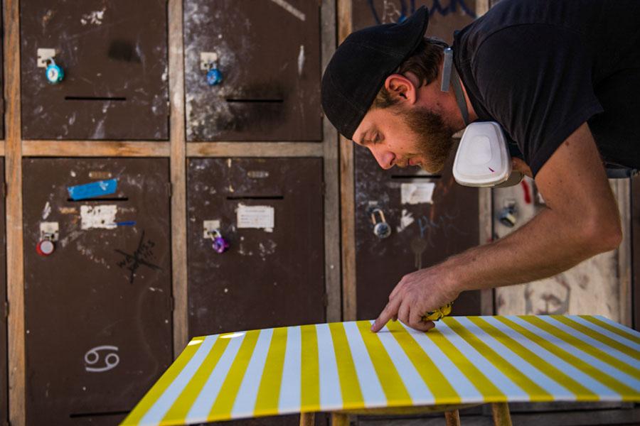 Sculpture artist Charles Starr cleans up lines on a panel that will be used for his new art piece on Tuesday, April. 29, at City College. Starr currently has a piece, titled Lost in Space, displayed in the Atkinson Gallery Annual Student Exhibition.