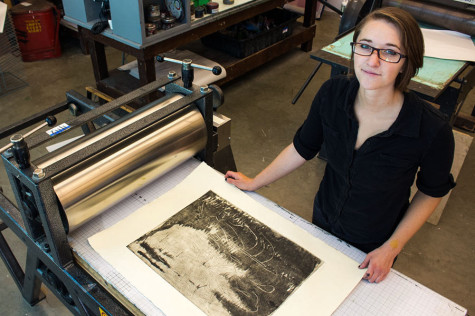 Sasha Colbert, 22, shows a print of her etching, "Staying Late," on an etching press on Wednesday, May 7, in the screen printing lab of the Humanities Building at City College in Santa Barbara, Calif. Colbert won three awards, including the President's Purchase Award, at the Annual Student Exhibition in the Atkinson Gallery for the original etching.