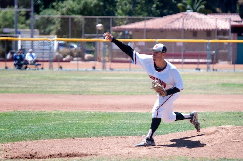 Vaqueros’ starter Justin Bruce (No. 11) delivers a pitch in the third inning of the first game against LA Mission College, Friday, May 9, at Pershing Park.  Bruce pitched eight innings, shutting out the Eagles, en route to a 3-0 City College victory. 