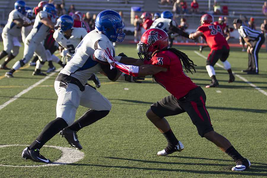 Vaquero defensive back Detavius Long (No. 3) holds off Wolverine wide receiver Darian Barrientos-Jackson (No. 9) in the 60th season opener against San Bernardino Valley College on Saturday, Sept. 6, at La Playa Stadium. City College lost against the Wolverines 18-10.