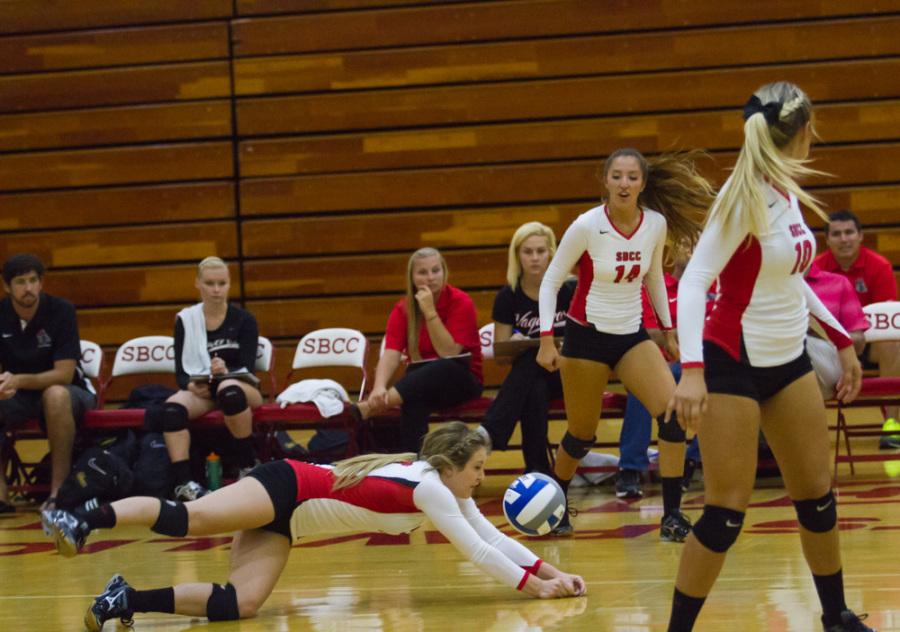 The Vaqueros Right Setter Alissa La Rocca (No. 3) makes a successful dive for the ball in City College’s first home opener against Cal Lutheran on Sept. 10, 2014. The Vaqueros walked away with unprecedented victory scoring over their competitor’s with 3-0.