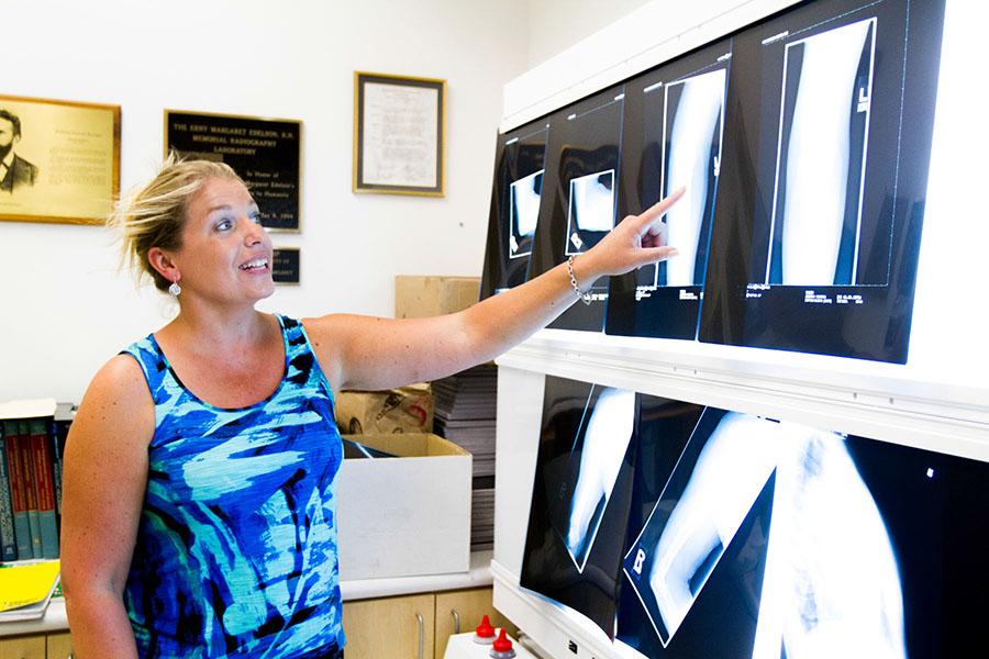 Trudy Ryan, the new associate Professor in Radiography & Imaging Science, shows x-ray images on a view box, in the City College Radiography Lab, Monday, Sept. 22, in Santa Barbara. Before Ryan started teaching in Aug., she worked with MRI and CT scanning at Santa Barbara Cottage Hospital.
