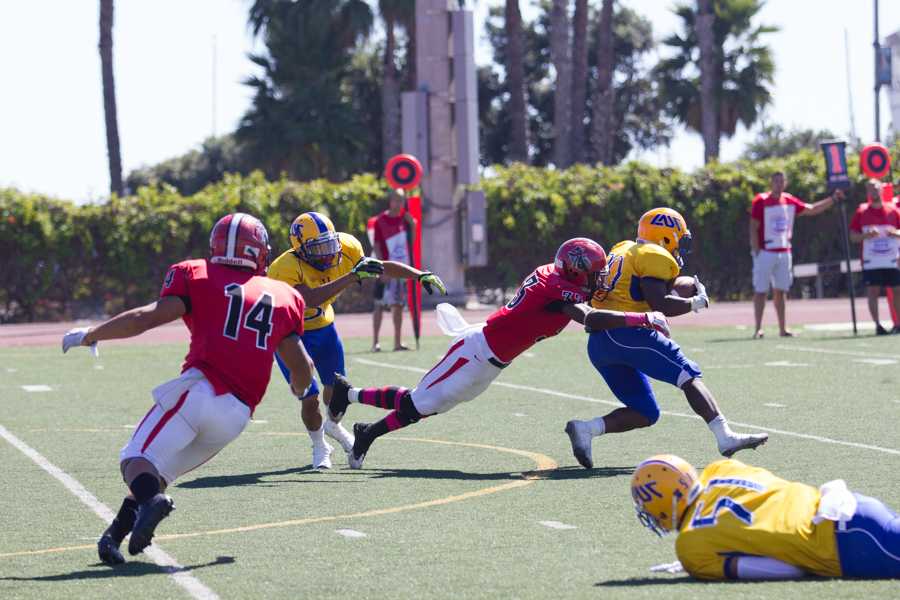 Freshman Malik Williams (No. 33) makes a tackle on LA Southwest College’s Latrell Flowers (No. 20) at Santa Barbara City College. Williams and the Vaqueros improved to 4-1 with the 30-18 win at home.