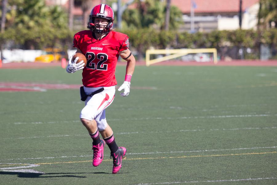 Tyler Higby (No. 22) runs the ball towards the end zone for the City College Vaqueros on Oct. 4 at La Playa Stadium. The Vaqueros are now 6-1