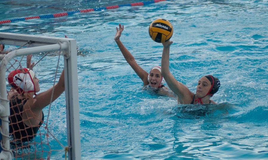 City college womens waterpolo utility player, Abdiel AJ Gravatt (No.17) scores against Pierce College goalie Sarah Karp (No.1) and field player Isabella McNealy (No.6) during the game at San Marcos High School in Santa Barbara, Calif. on Wednesday, Oct. 22, 2014. The Vaqueros beat the Brahmas 12-6.