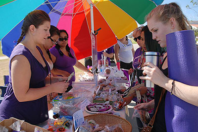 Nursing student Ashley Contreras (front left), 22, sells baked goods with the Rupe Troupe to psychology major Grace Green (front right), 19, on Thursday, Oct. 23, at the nursing program's bake sale supporting the upcoming annual 'Walk To End Alzheimer’s’, on West Campus of City College.