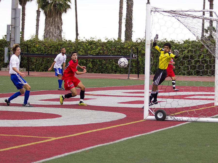 Vaquero forward Gonzalo Jimenez (No. 17) scores against Santa Monica College’s goalkeeper Westin Adkins to make the score 3-1 in the second half, Tuesday, Nov. 11, at La Playa Stadium in Santa Barbara. The Vaqueros beat the Corsairs 4-2 in the last home game of the season.