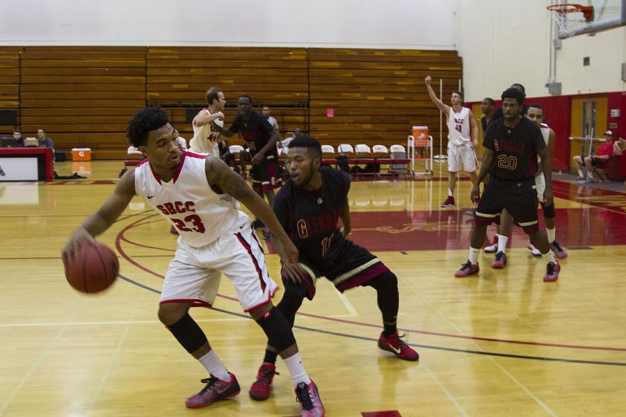 Santa Barbara City College sophomore point guard and returning starter Alonzo McCain (No. 23) shields off a defender at Santa Barbara City College, Calif. Tuesday, Nov. 25. McCain ended the game with 3 points, 3 rebounds and 6 assists.