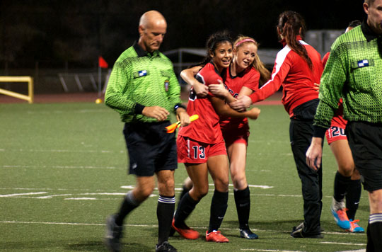 City College forwards, Sandy Grimaldo (No.13) and Michelle Day (No.2) celebrate after winning the womens soccer conference game on Tuesday, Nov. 11, at La Playa Stadium in Santa Barbara. The Vaqueros beat the Pirates 3-0.