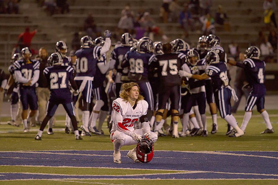 City College’s Tyler Higby (No. 22) crouches down seconds after losing to Cerritos College in the Golden State Bowl on Saturday, Nov. 22 in Norwalk, Calif. The Vaqueros could not hold on to the lead in the closing minutes of the game losing 22-19.