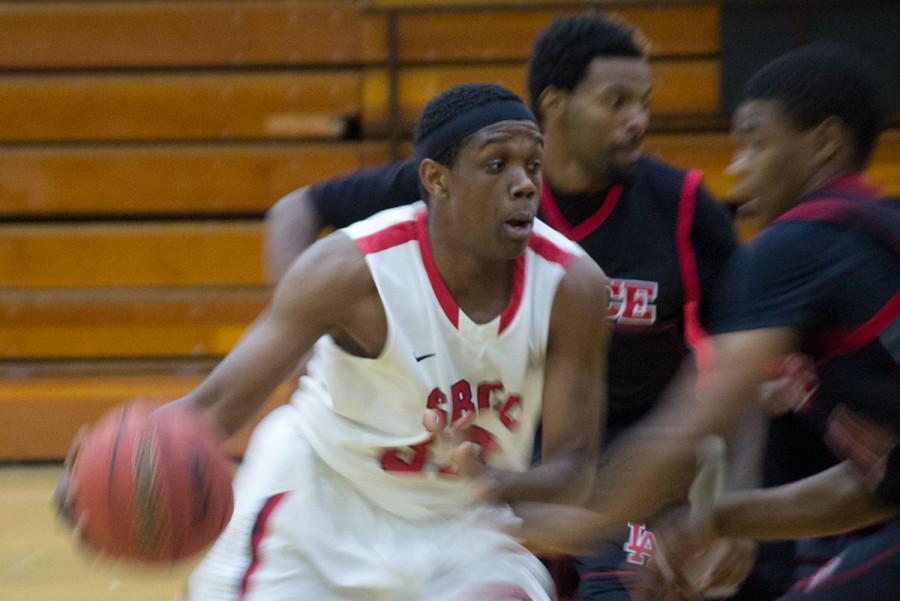 City College Guard Sean Keyes (No. 33) races down the court looking for an open teammate to pass the ball to as he’s blocked by opponents from Los Angeles Pierce College, Wednesday, Jan. 28, 2015, in the Sports Pavilion. The Vaqueros lost 92-46.