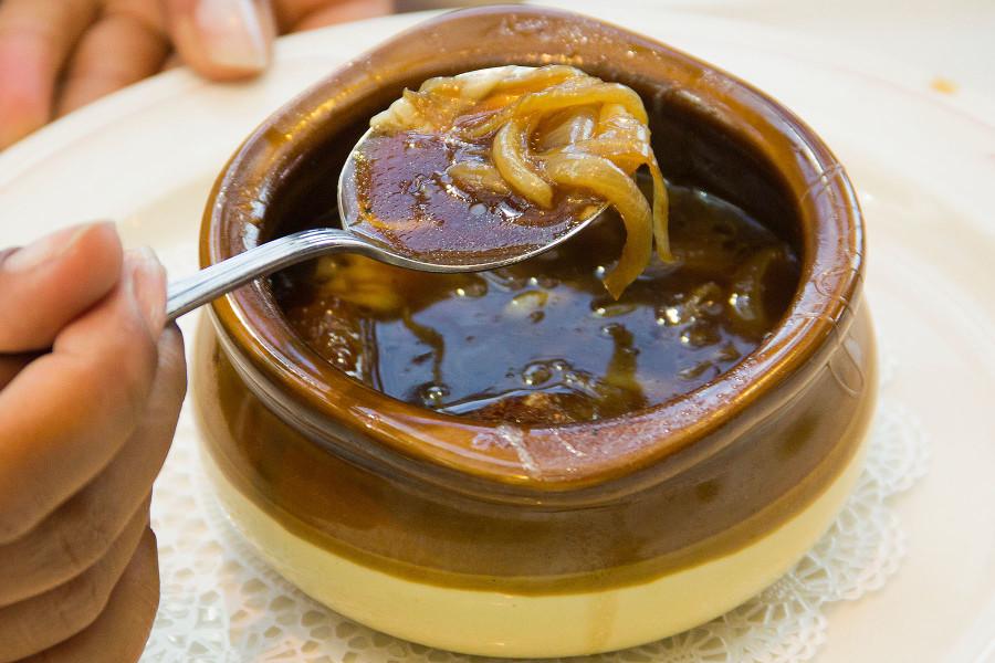 The onion soup gratinée is filled with onions, sourdough bread, and Gruyere cheese, served during lunch at the John Dunn Gourmet Dining Room, Monday, Feb. 23, on East Campus. Reservations are recommended for lunch and dinner, open from 11:30 a.m. to 12:45 p.m. Monday through Friday, and 5:30 p.m. to 6:30 p.m. Thursday and Friday.