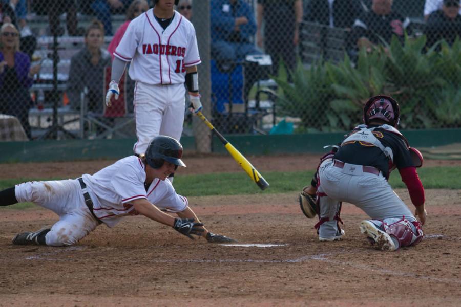 Spencer Erdman (No. 5) slides into home on a wild pitch, tying the game 4-4 against Glendale, Thursday, Feb. 5th, 2015, at Pershing Park in Santa Barbara, Calif. After extra innings, the City College went on to beat Glendale 6-5.