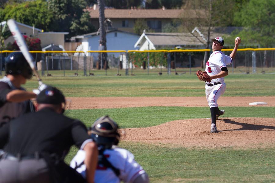 City College pitcher Sean Berry (No. 12) throws a strike during the second inning against Moorpark College, Thursday, March 19, at Pershing Park in Santa Barbara. Berry, the Western State Conference leader in strikeouts, fanned 8 batters in the game, bringing his total to 50 this season. The Vaqueros went on to win the game against Moorpark College, 6-1.